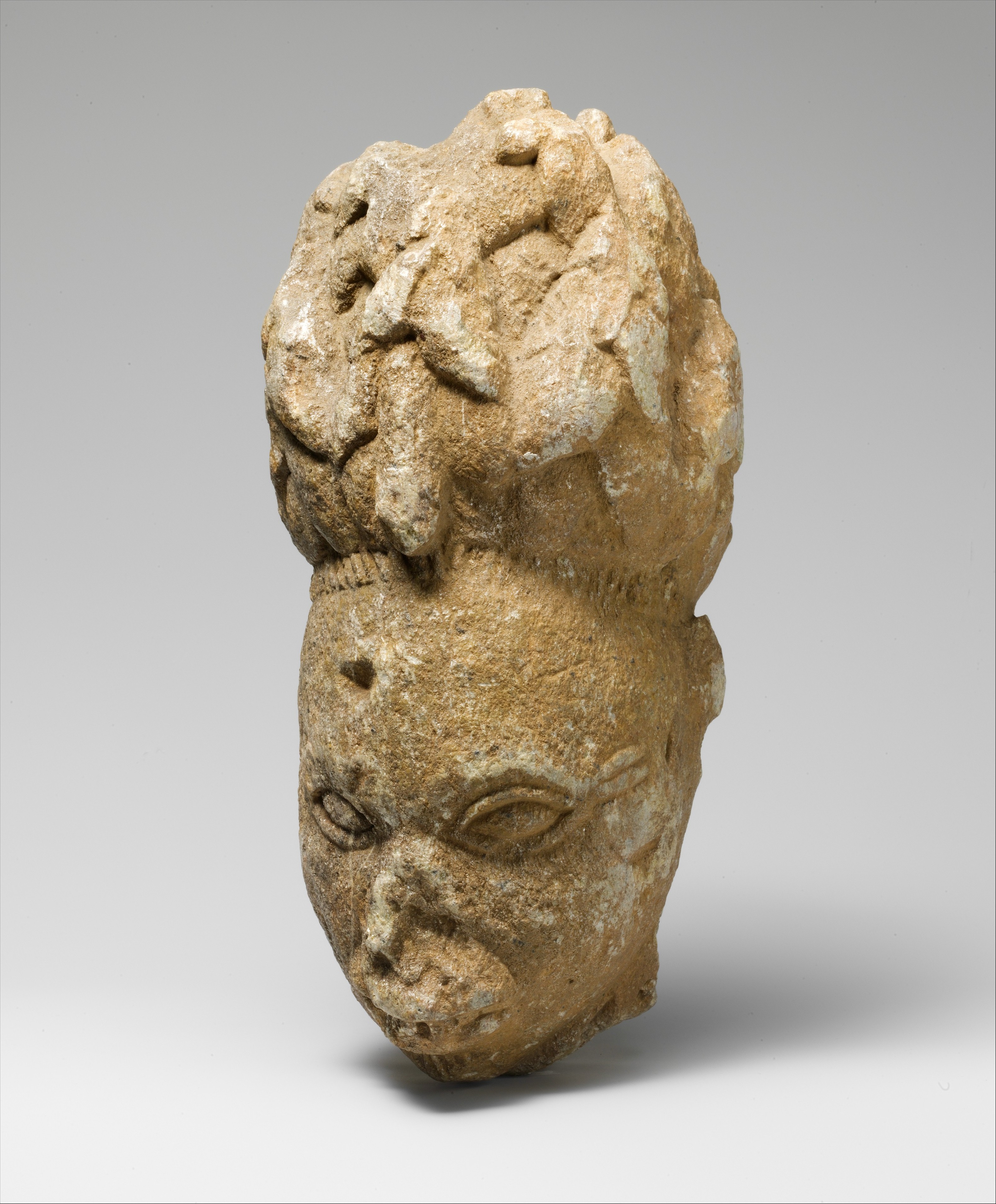 Stone Yoruba head from a figure from the Esie region of Nigeria.